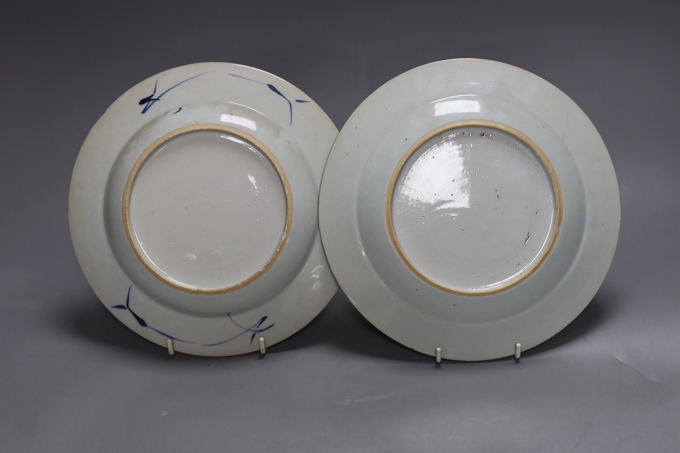 An 18th century Chinese export famille rose plate, similar saucer and an 18th century Chinese vert Imari plate, largest 22.5cm